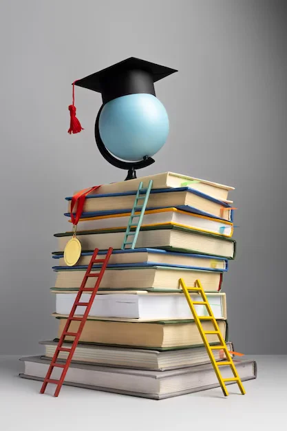 books & ladder & graduation cap